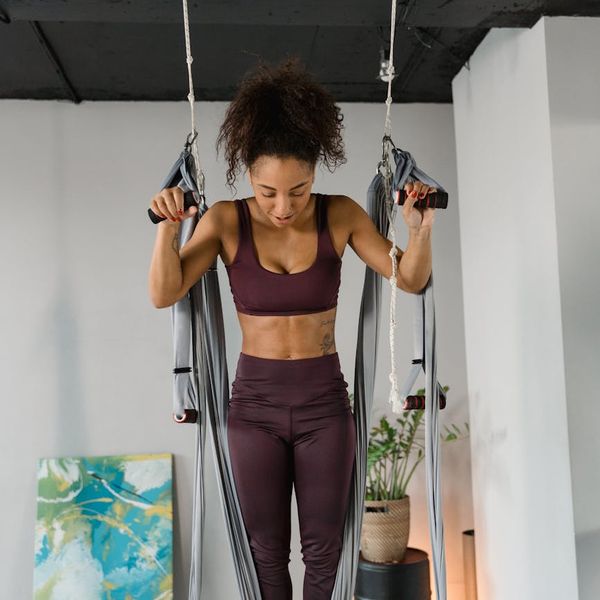 Person stretching peacefully in a calm, modern environment.